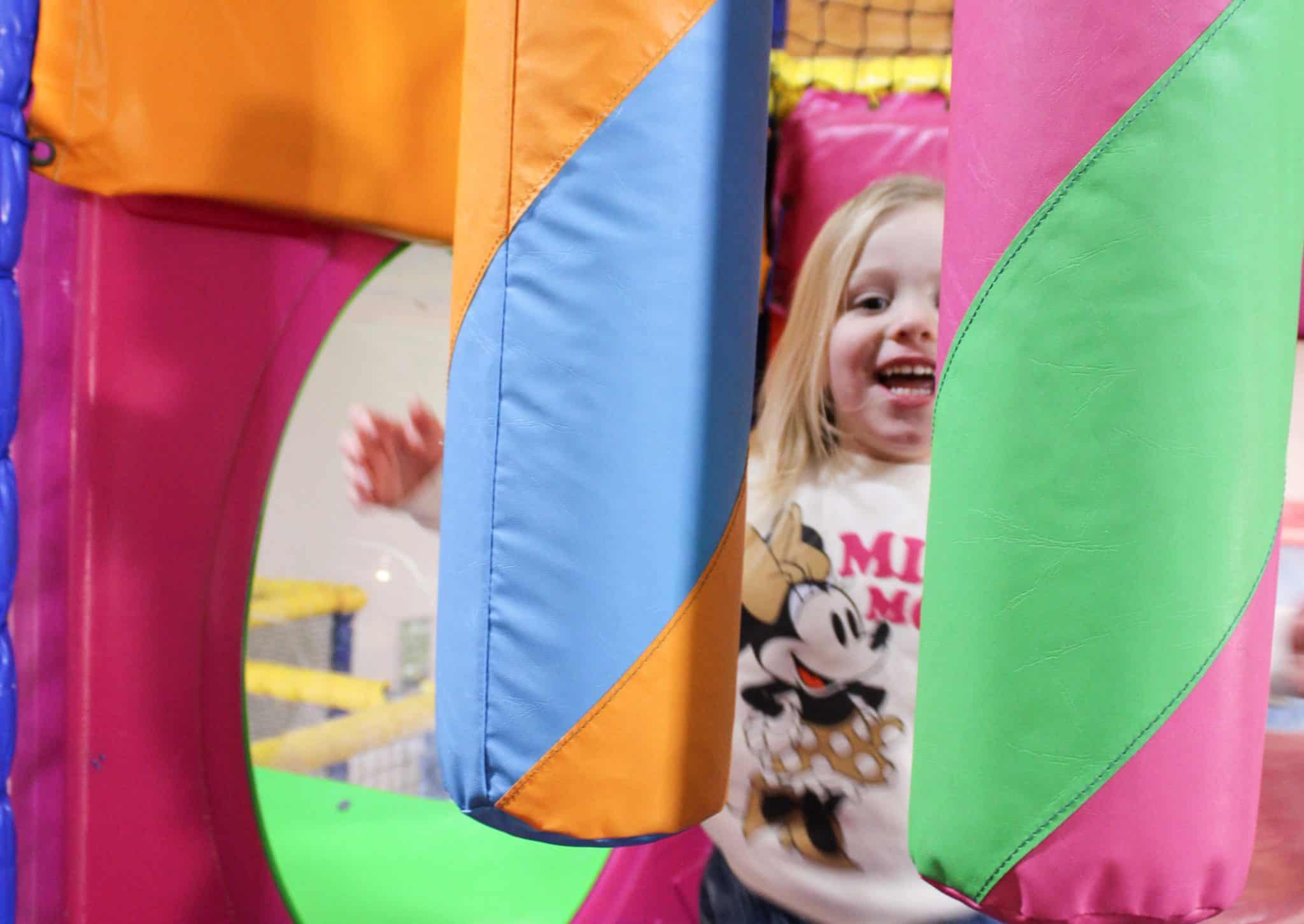 Kid laughing in soft play area at bewl water