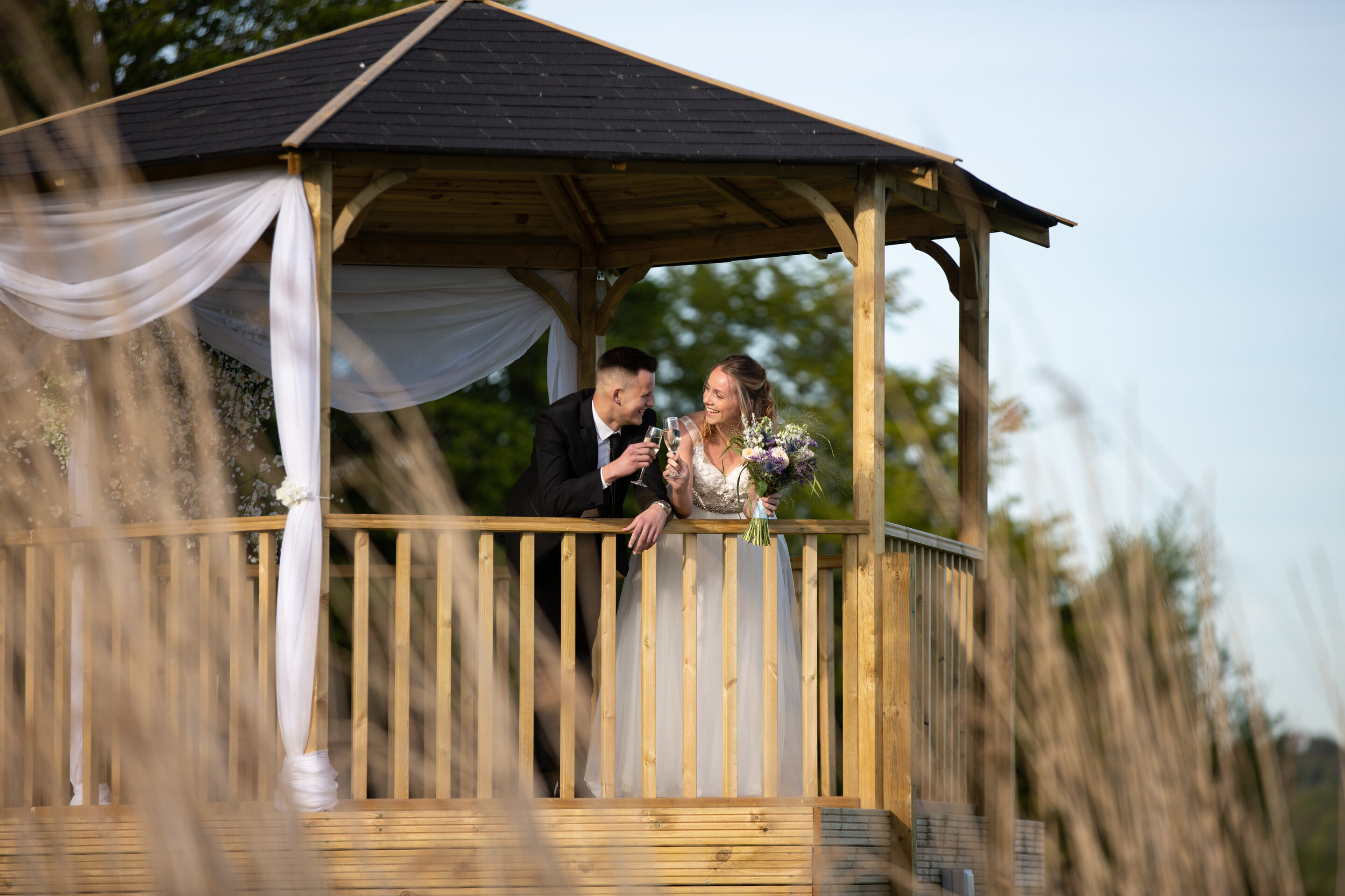 Couple making talking with glasses of champagne