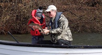 Boy catches first fish