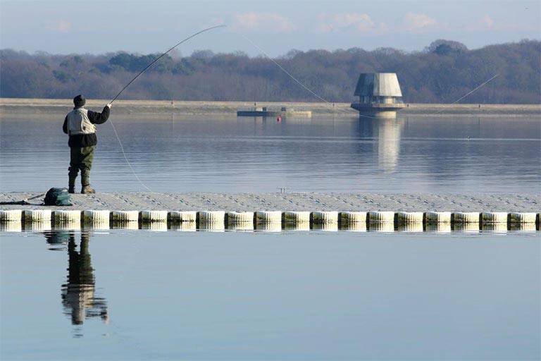 Fly fishing man in winter