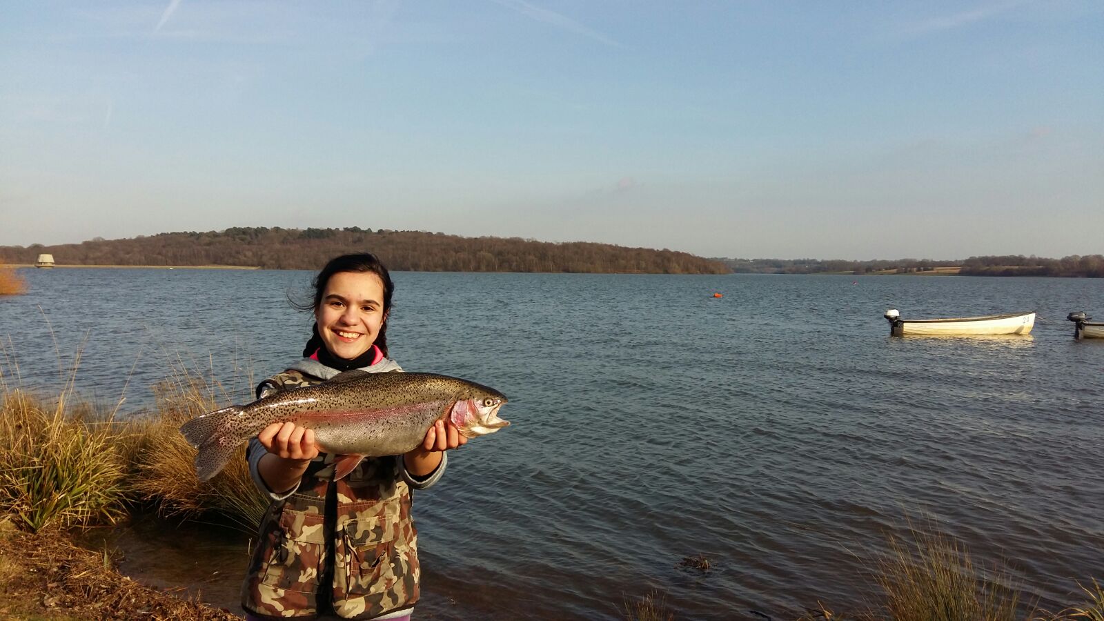 Person holding a fish at bewl water