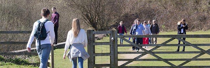 Gate with people walking on both sides