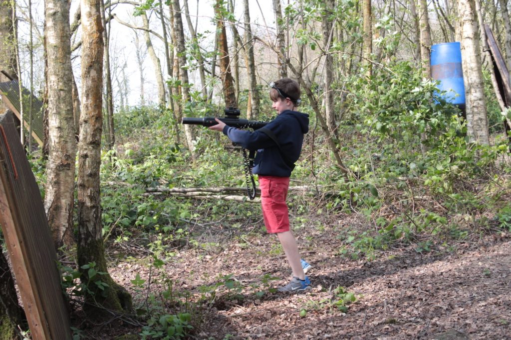 Kid playing laser tag adventure at bewl water