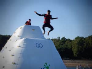 Person jumping from wibit climbing inflatable