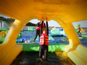 Person hanging under an inflatable