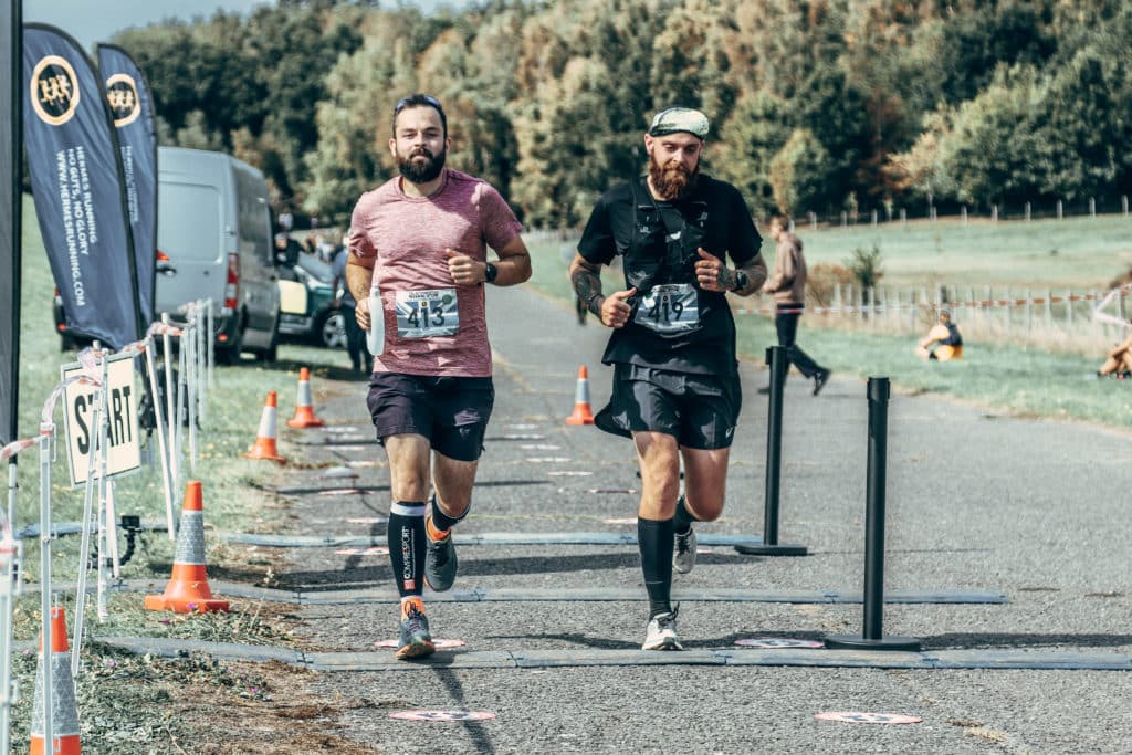 Two people running the hermes marathon