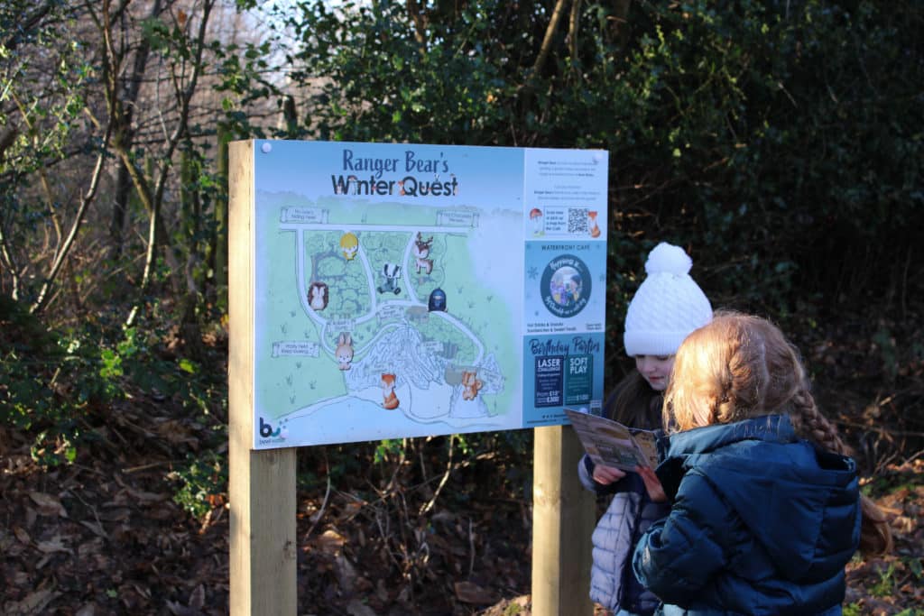 Kids in front of the ranger bears winter quest map