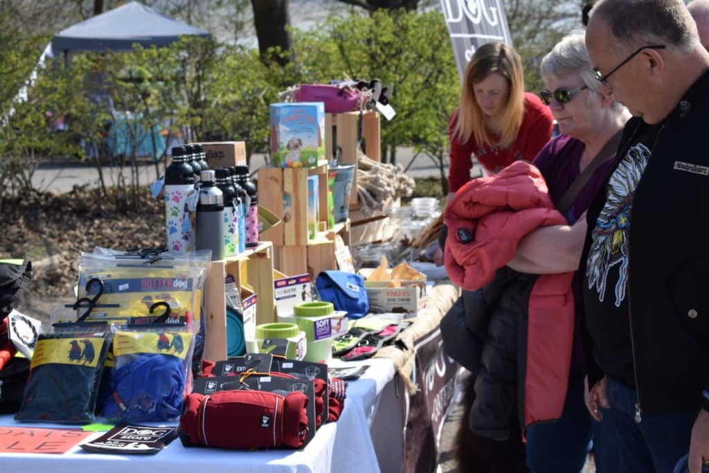 People looking at dog store products