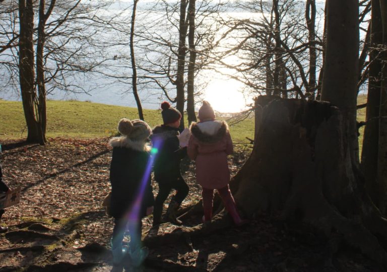 Kids next to tree stump at bewl water