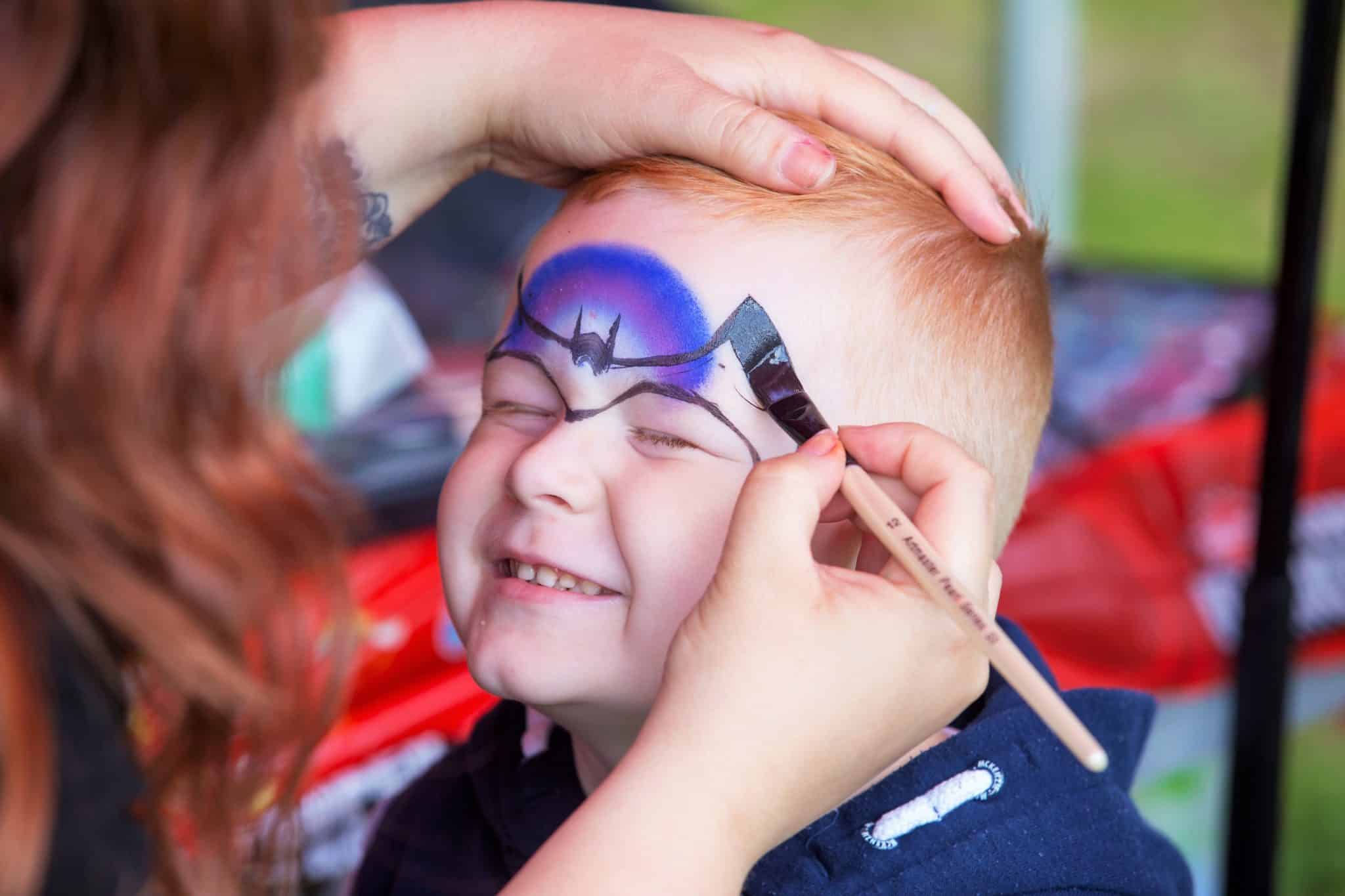 Boy Getting his face painted
