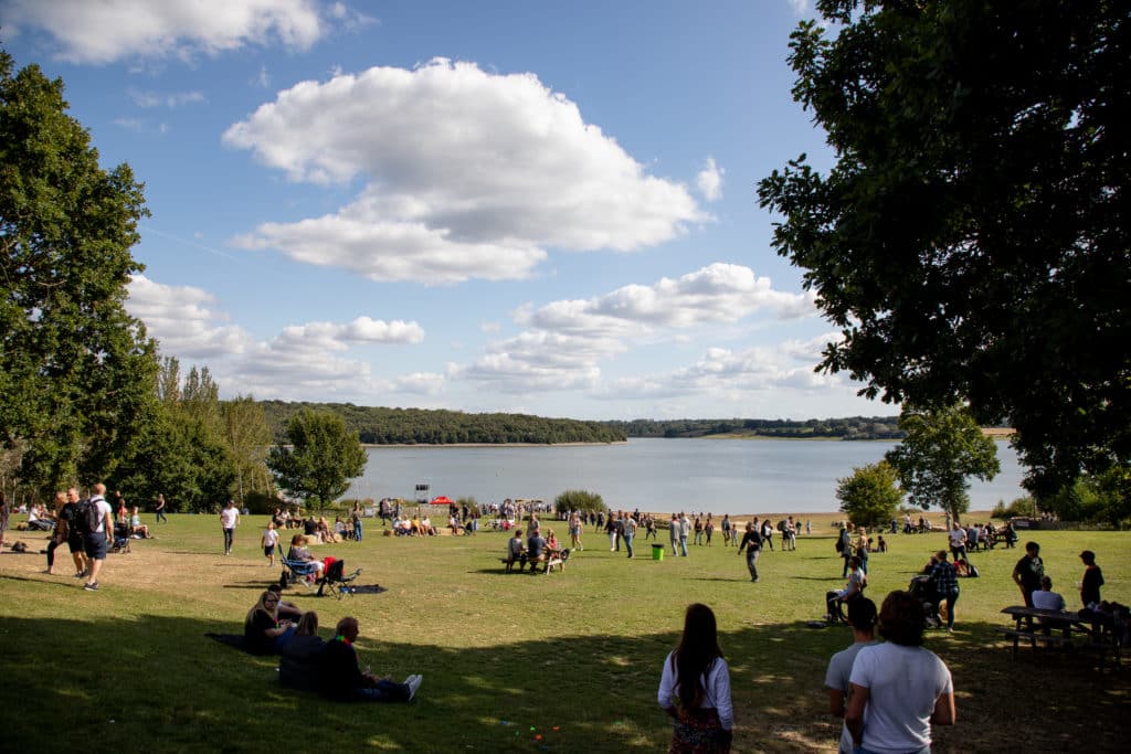 People walking and sitting at bewl water