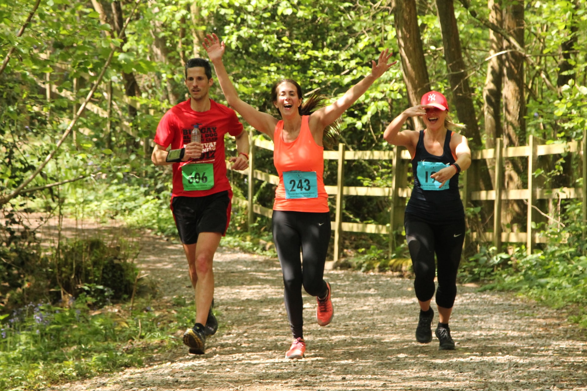 Three people running at bewl water swim run