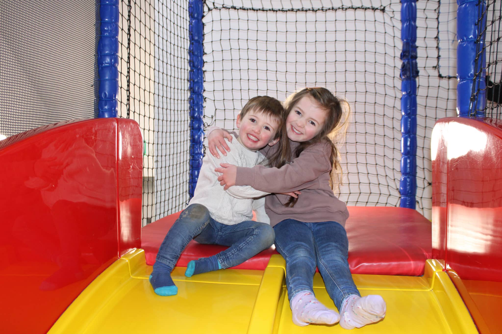 Two Kids in the soft play area
