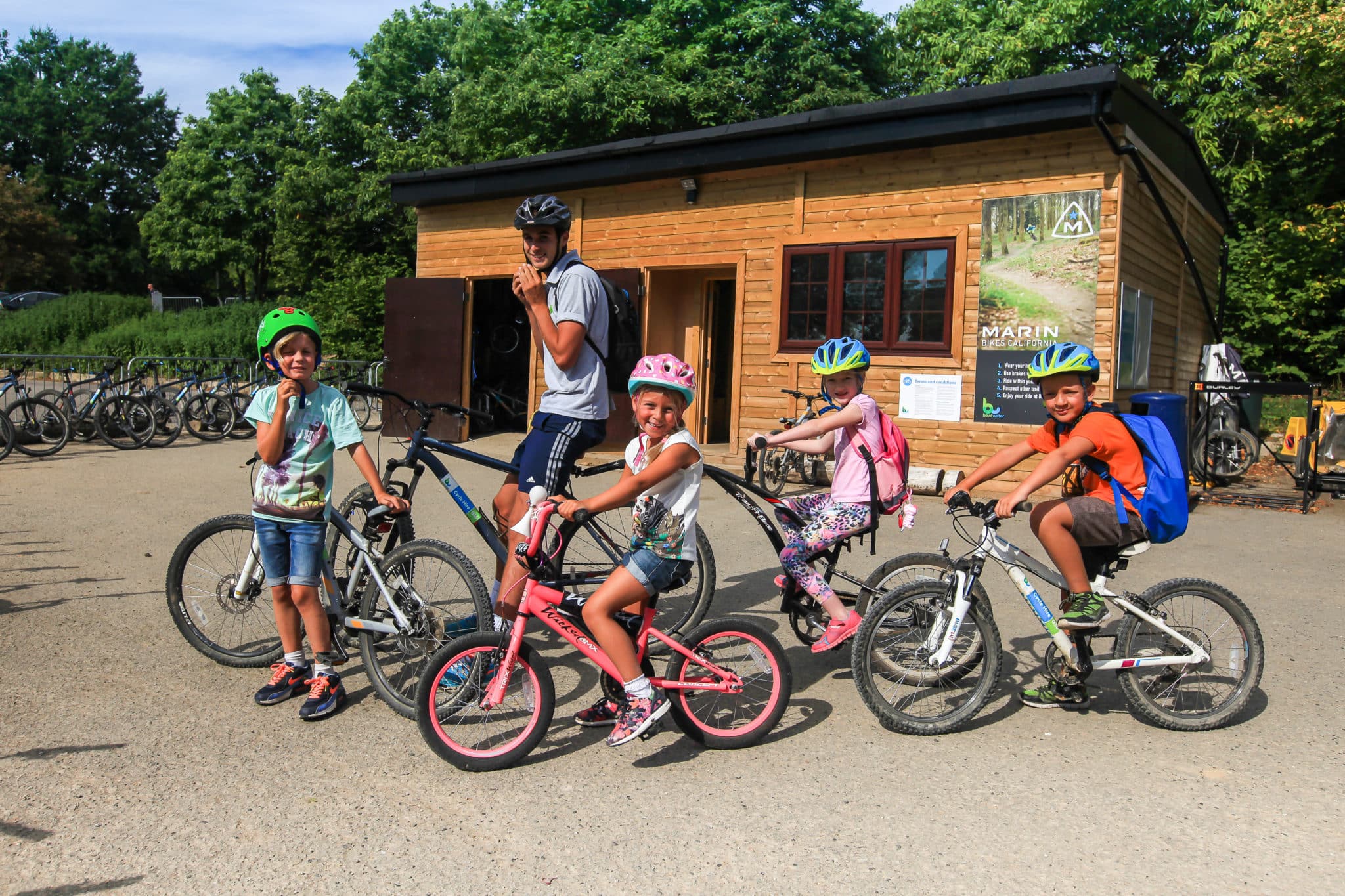 Family of 5 riding on bikes