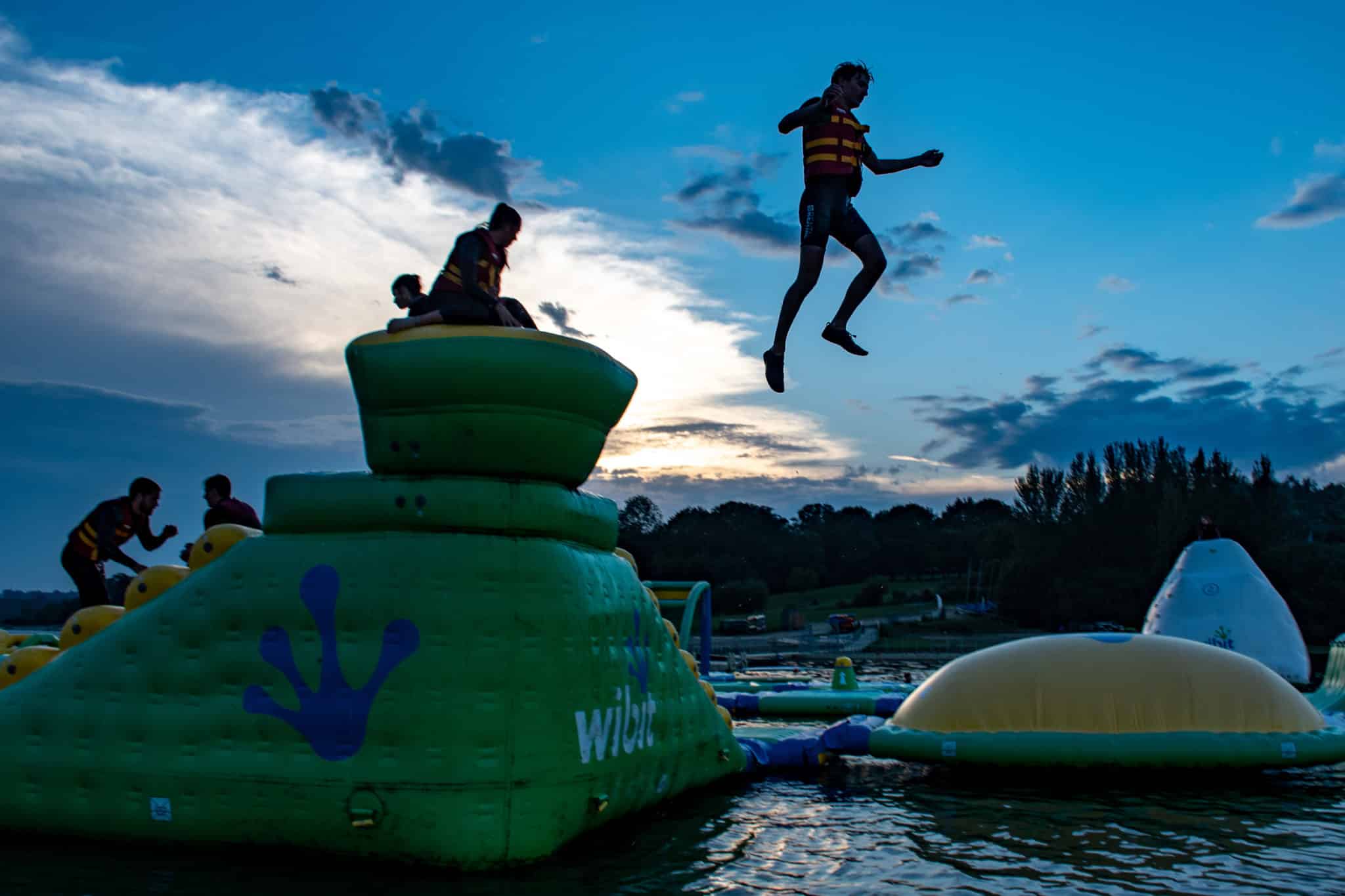 Person jumping from wibit inflatable