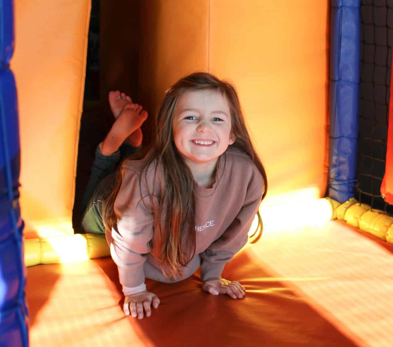 Girl smiling in soft play area