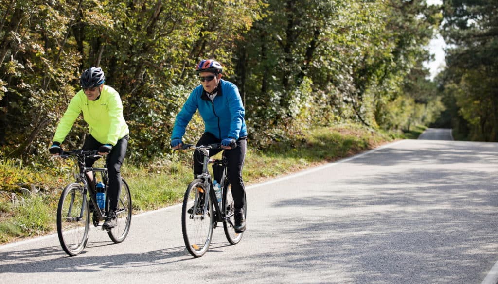 Two elderly men cycling on Bewl Water Cycle path