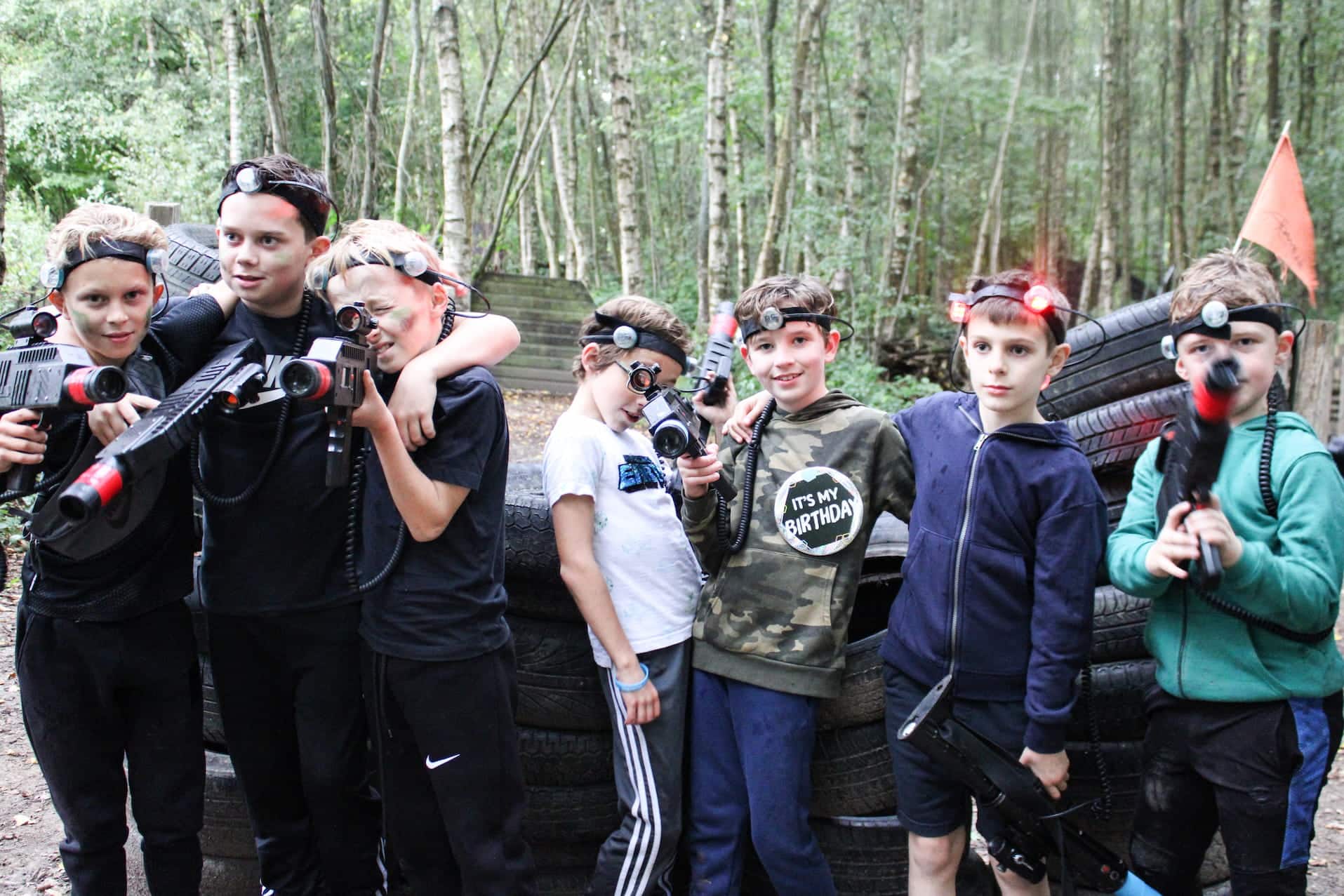 Kids standing together with their laser tag guns