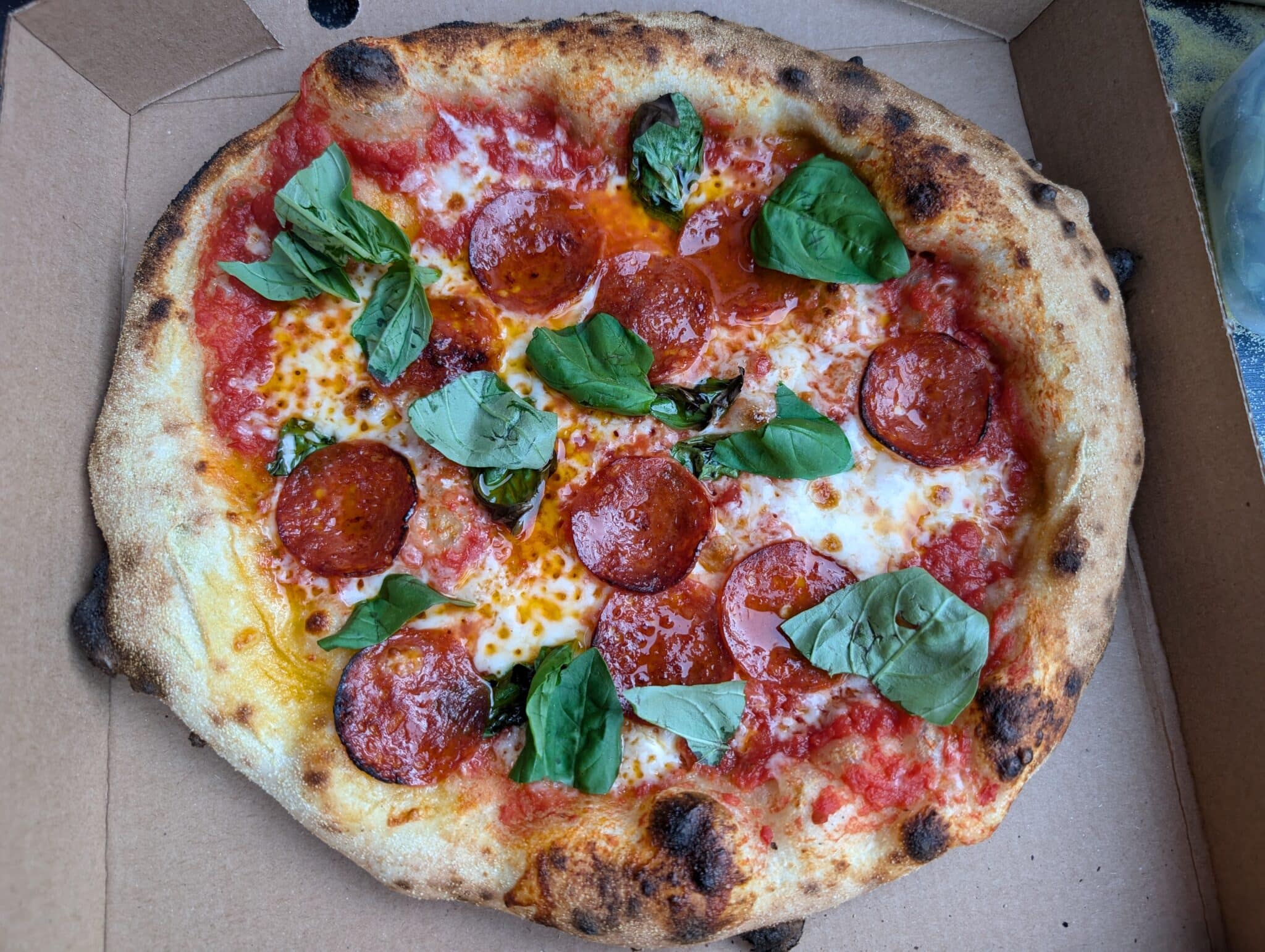 Freshly baked wood-fired pepperoni and basil pizza at Bewl Water, Kent – ideal post-swim food for open water swimmers in the heart of Kent.